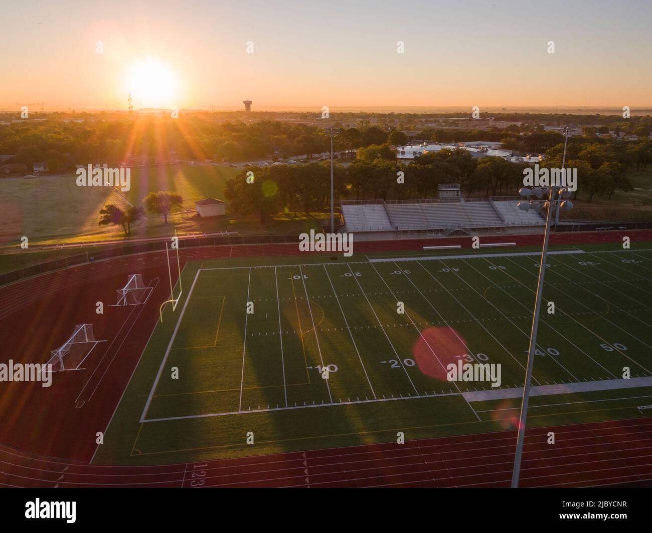 Aerial shot of a high school track and football field in Texas at