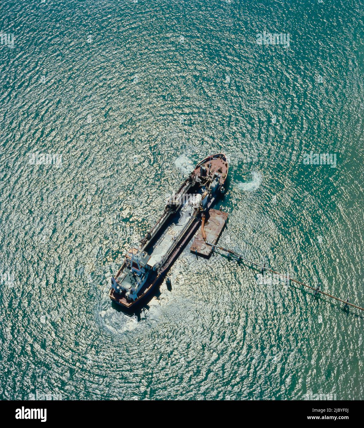 Aerial of Sand Dredge working at sea Stock Photo