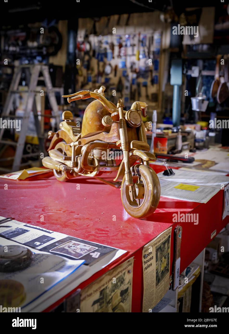 Close up of workbench and handcarved motorcycle Inside of