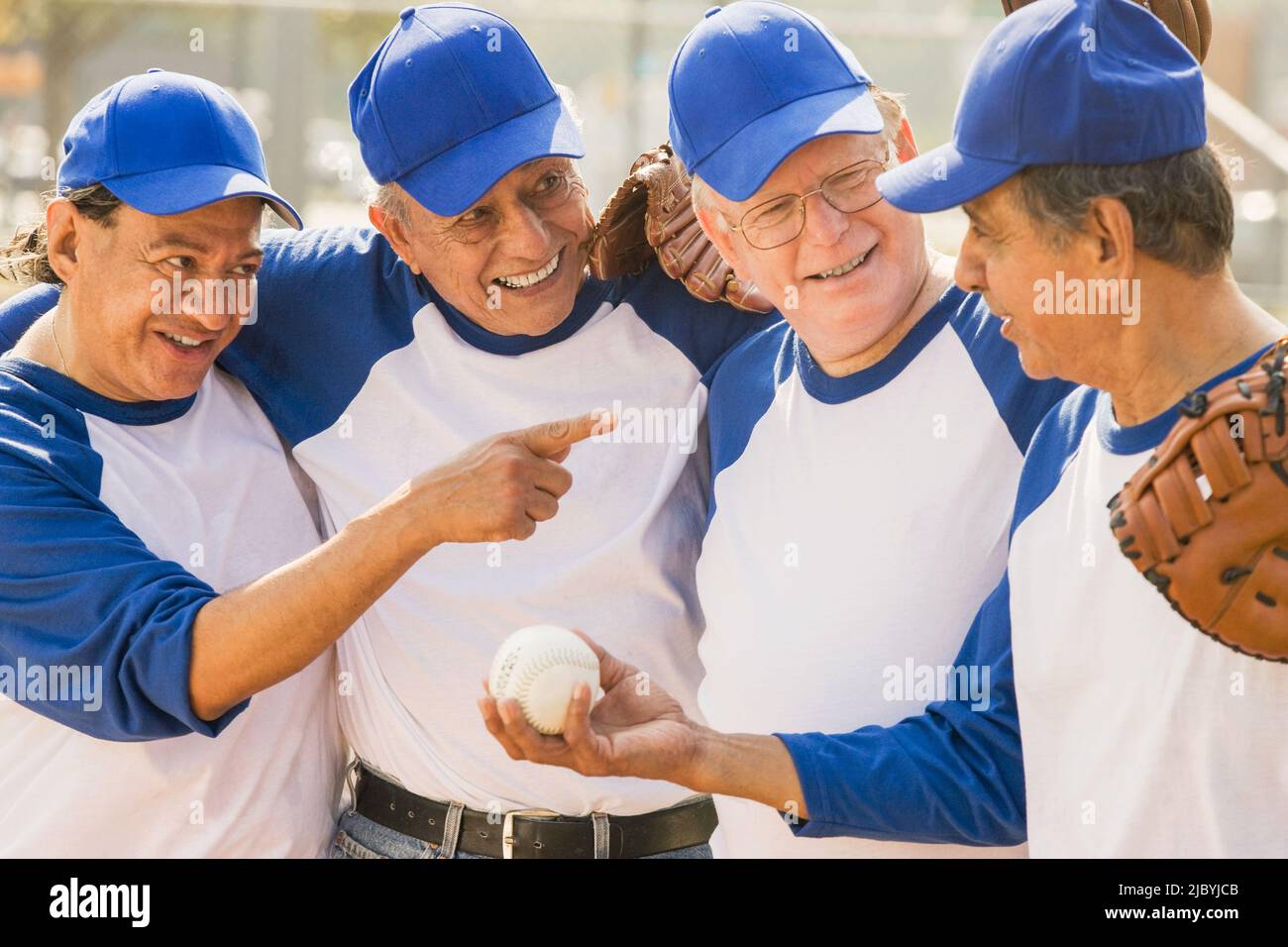 Senior men playing on baseball team Stock Photo