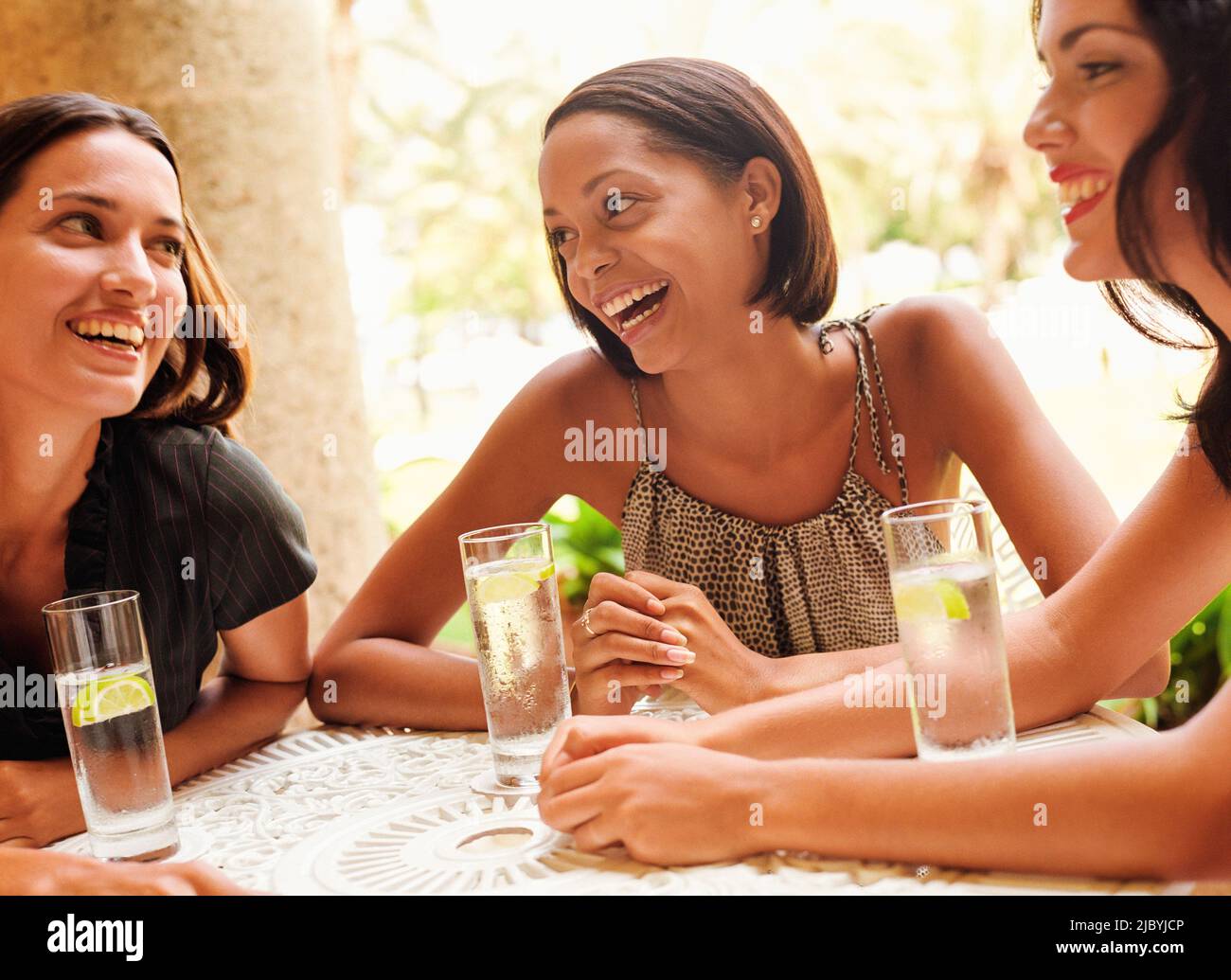Friends drinking in restaurant Stock Photo