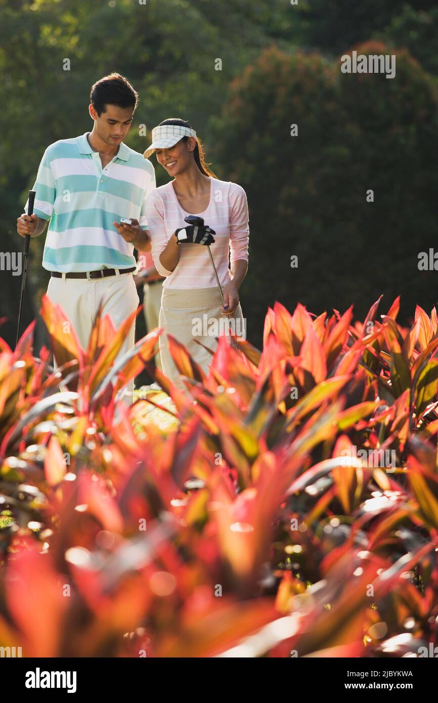Couple golfing together Stock Photo