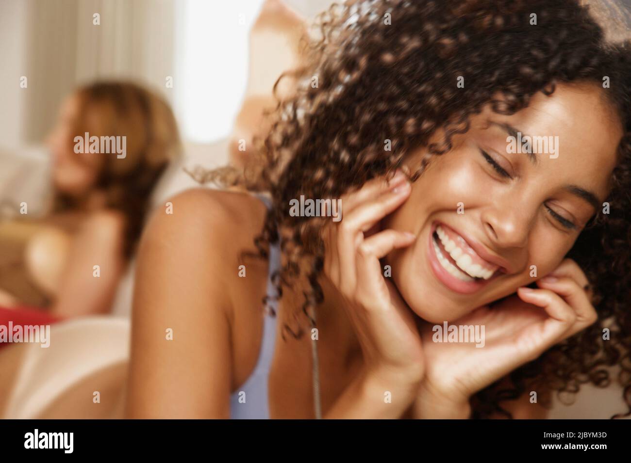 Mixed race woman laughing Stock Photo