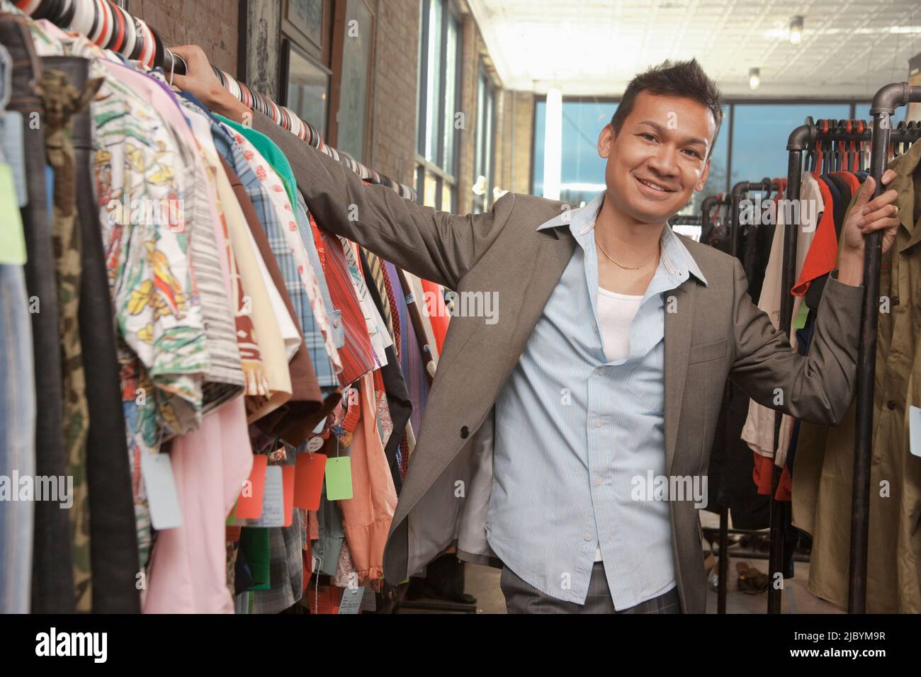 Malaysian man shopping in vintage store Stock Photo Alamy