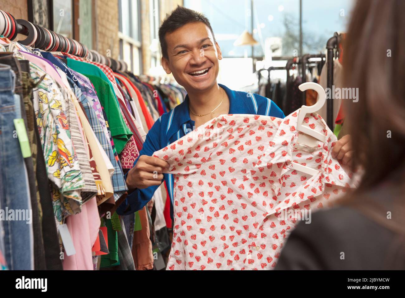 Malaysian man shopping in vintage store Stock Photo Alamy