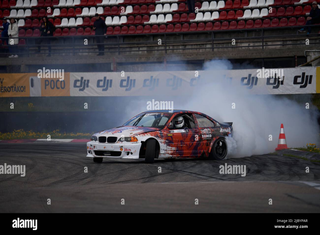 21-05-2022 Riga, Latvia car drifting on asphalt racing track with lot of smoke, motion blur drift car.. Stock Photo