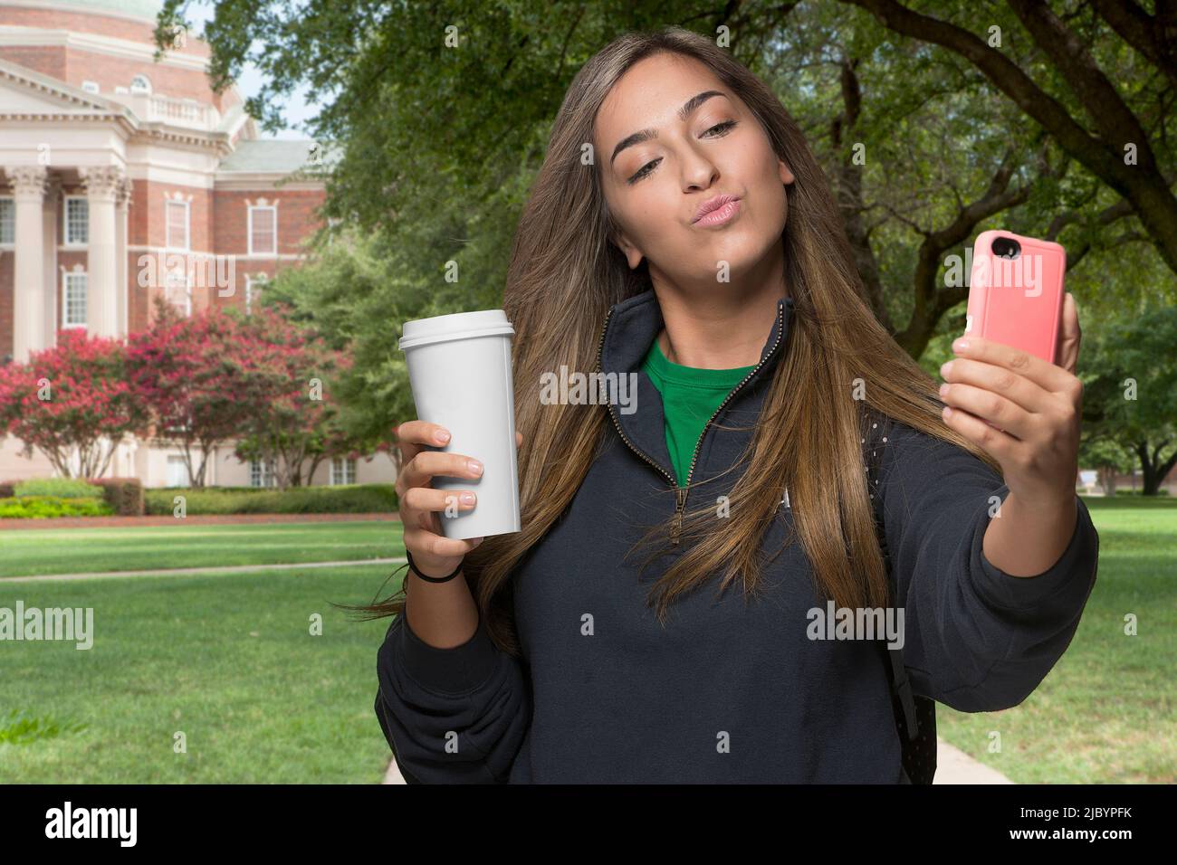 Middle Eastern student taking selfie on college campus Stock Photo