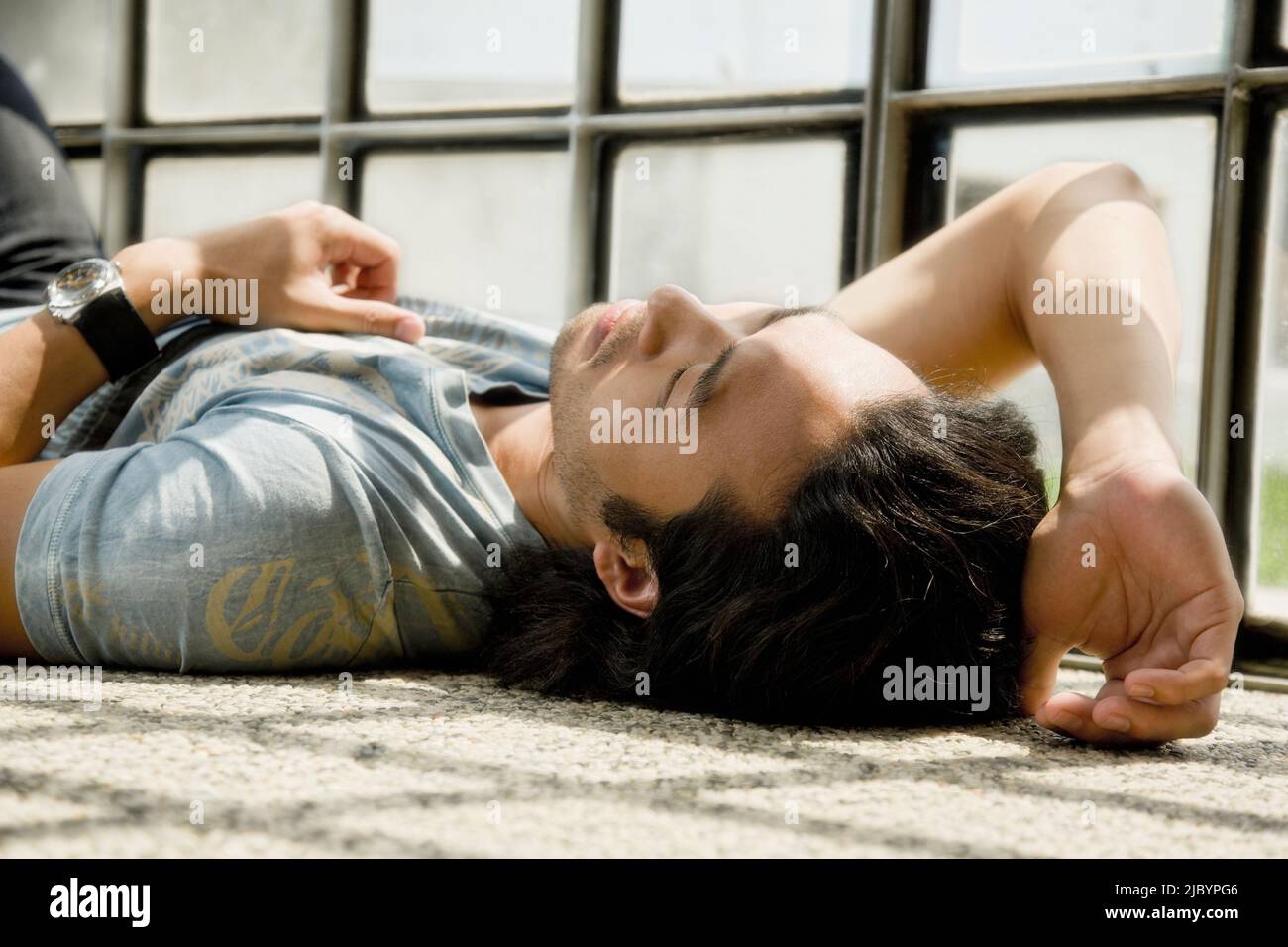 Korean man laying on floor Stock Photo