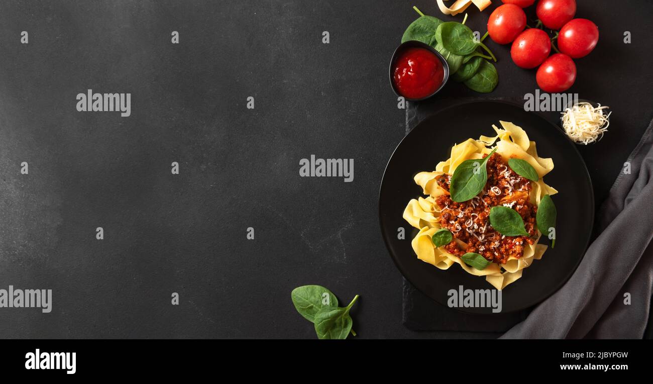 Italian Cuisine. Italian cuisine pasta on gray background with empty space for text Stock Photo