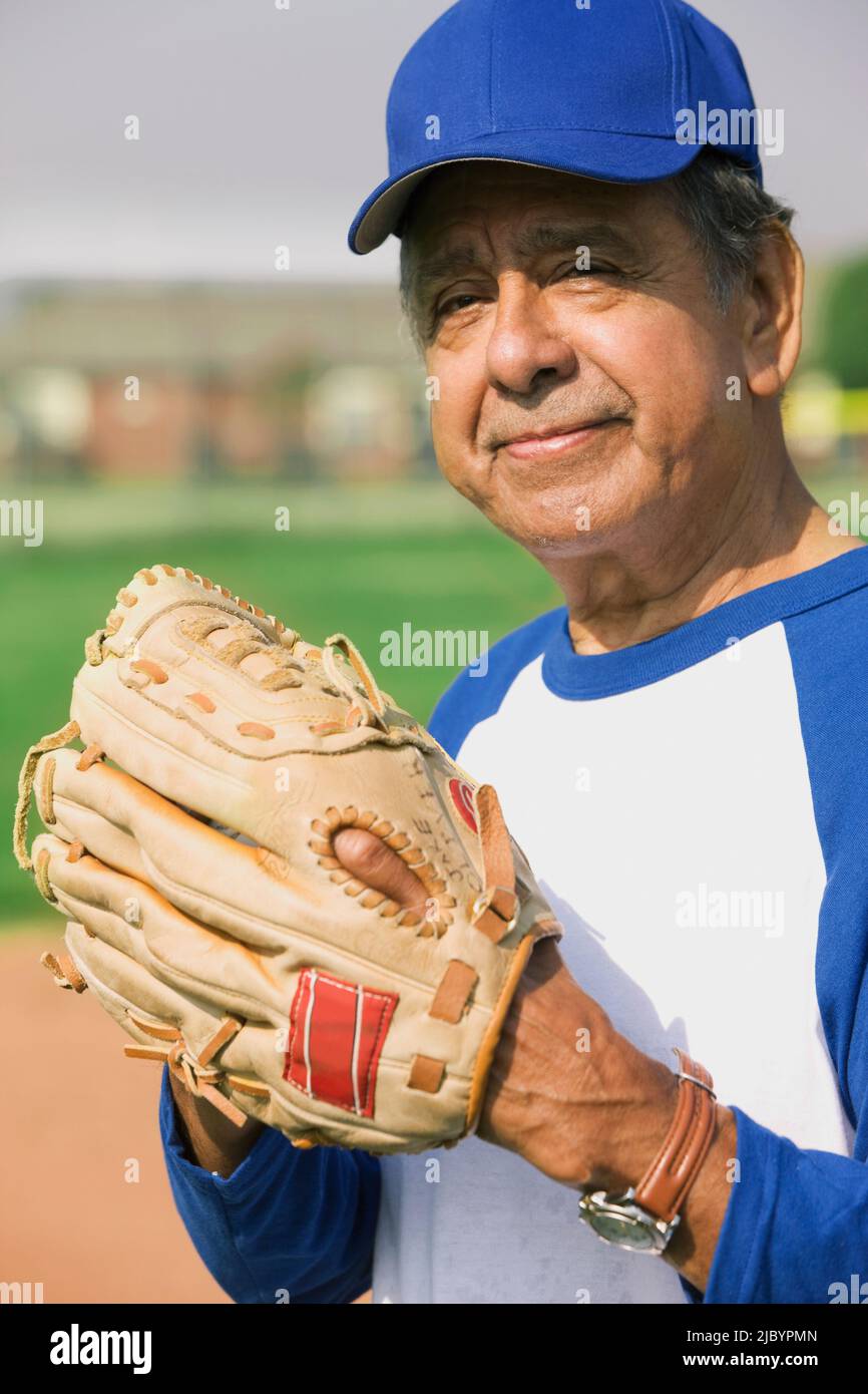 Closeup Of Smiling Hispanic Baseball Player Looking Away Stock