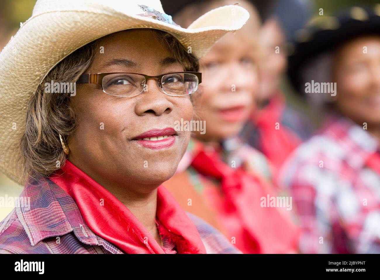 African woman wearing cowboy hat Stock Photo