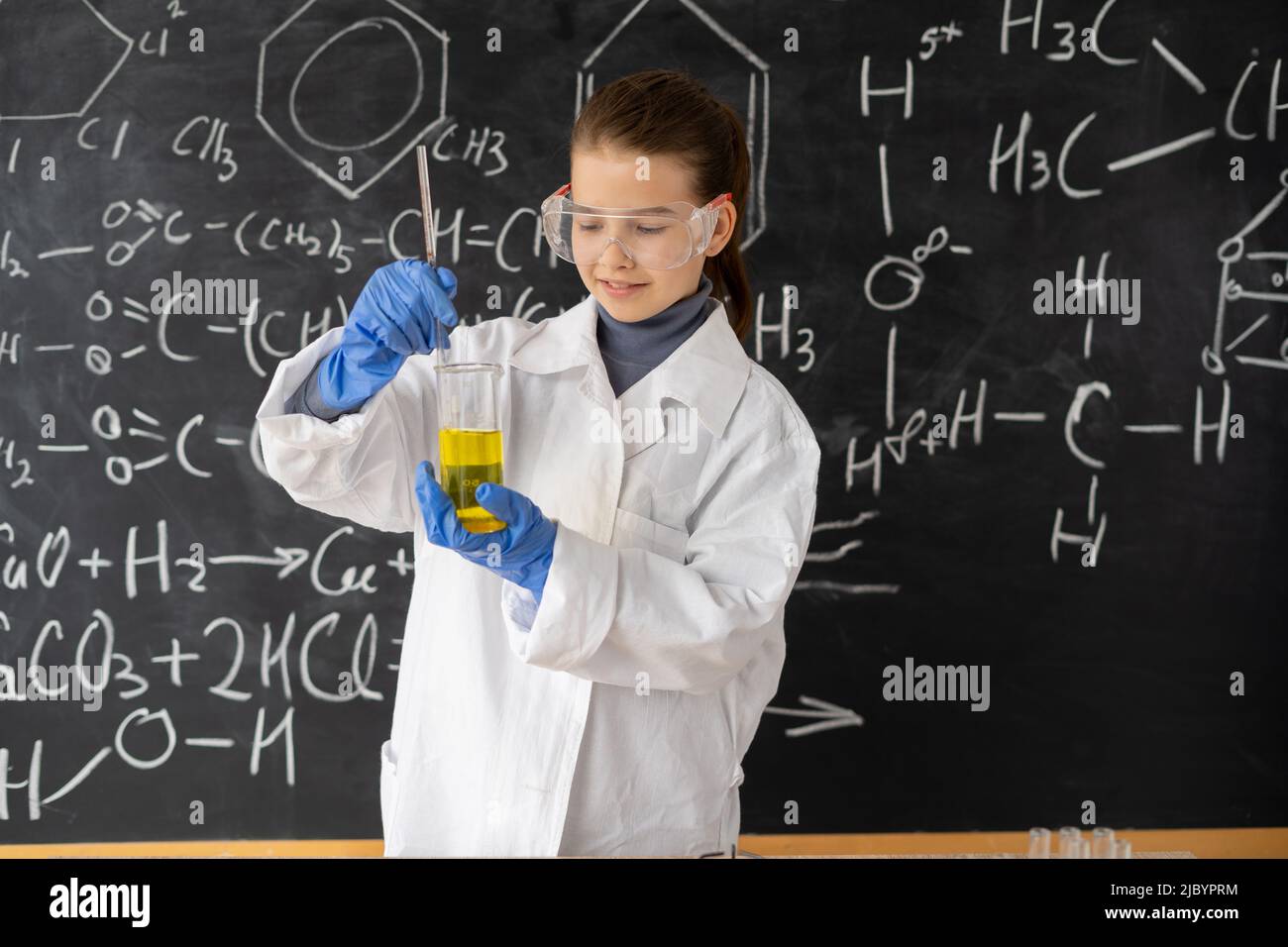 girl student doing science experiment result or chemical reaction at
