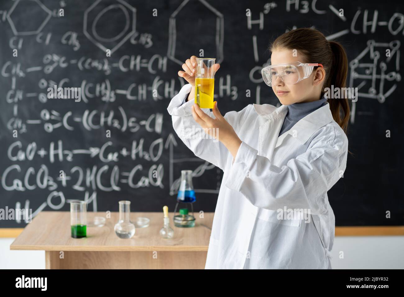 Chemistry class student doing experiment hi res stock photography and