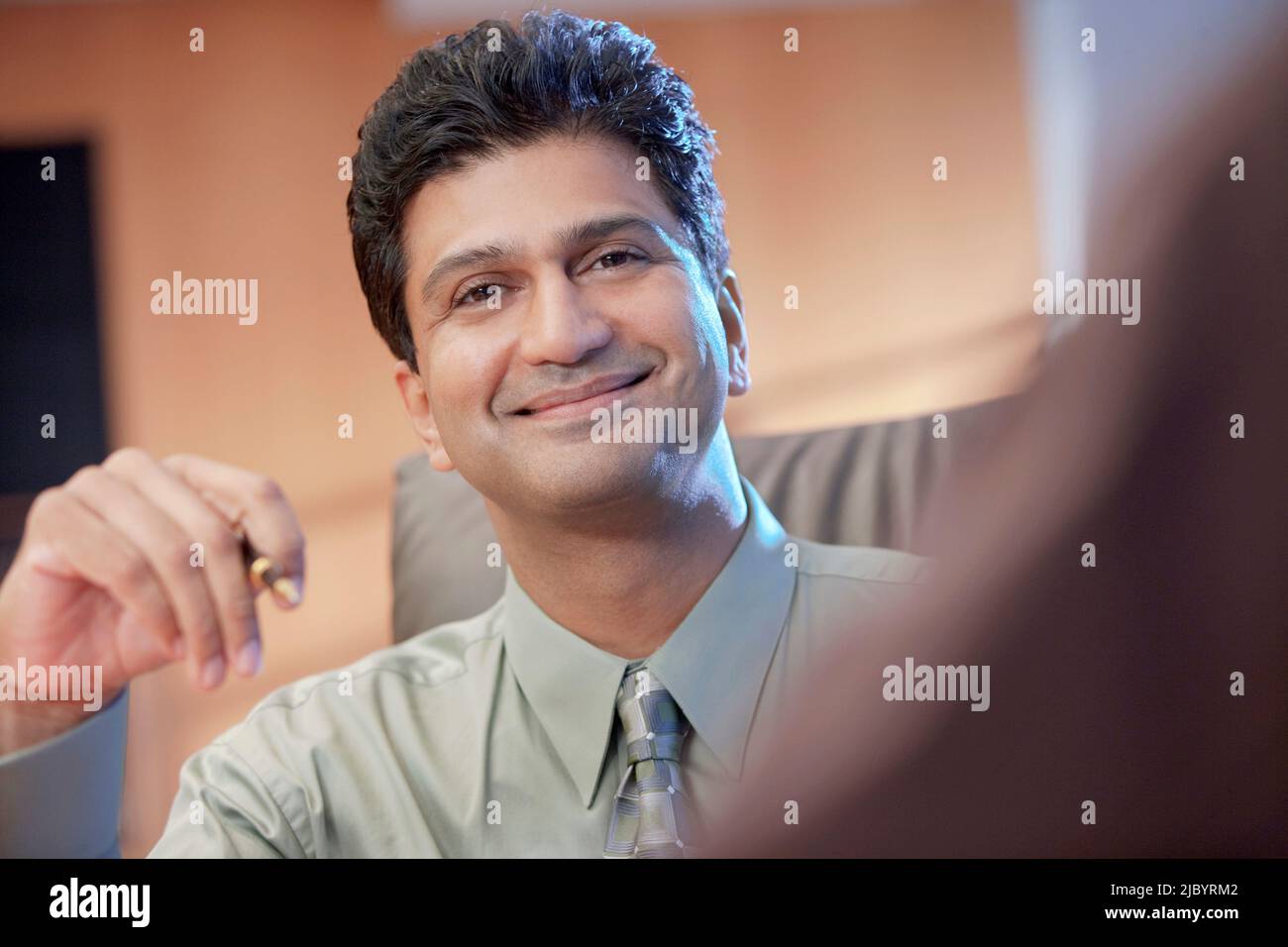Smiling Indian businessman Stock Photo