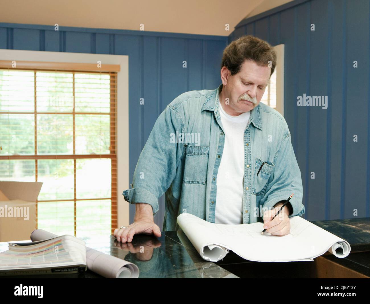 Architect reviewing blueprints Stock Photo