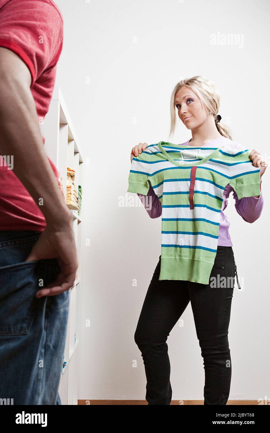Couple shopping for clothes Stock Photo