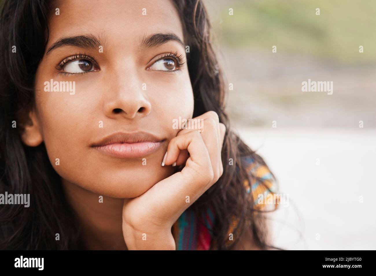 Woman resting hand on chin hi-res stock photography and images - Alamy