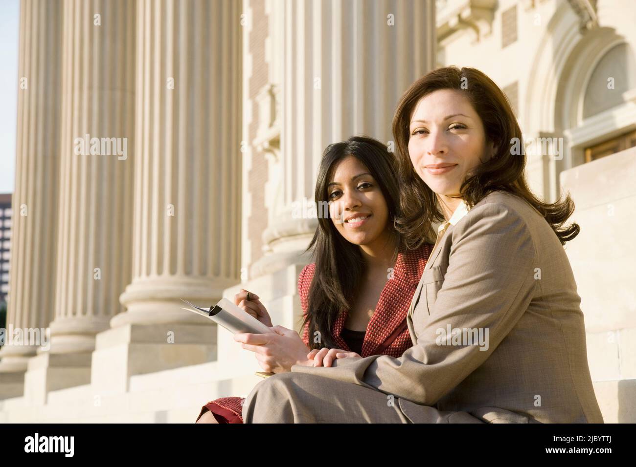 Multi-ethnic businesswomen with paperwork Stock Photo