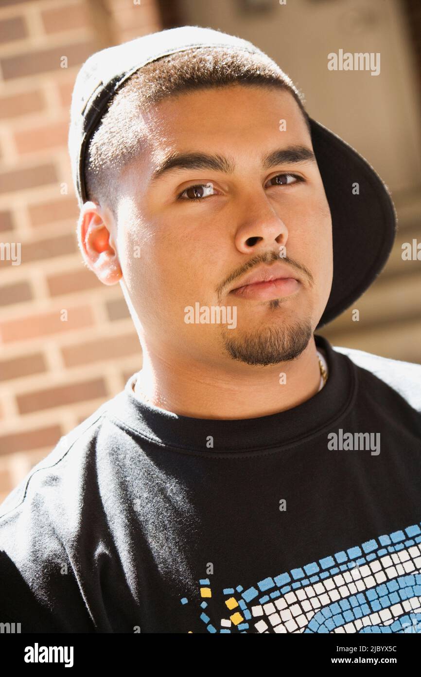 Man wearing baseball cap backwards hires stock photography and images