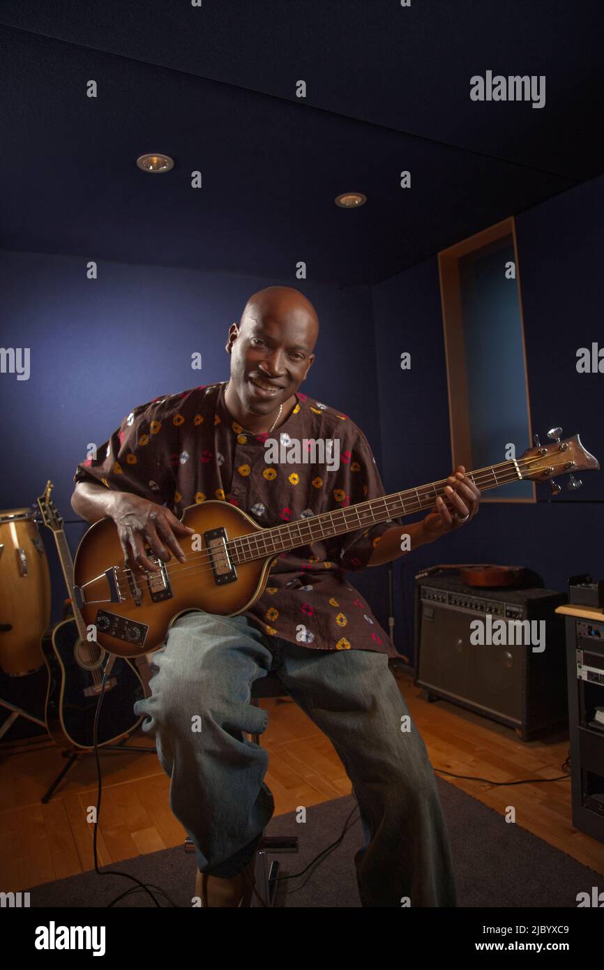 African American man playing guitar in studio Stock Photo - Alamy