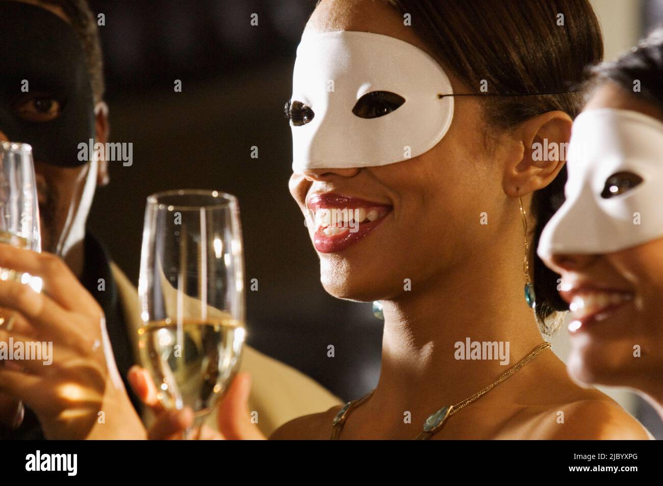 Close up of African woman at masquerade party Stock Photo