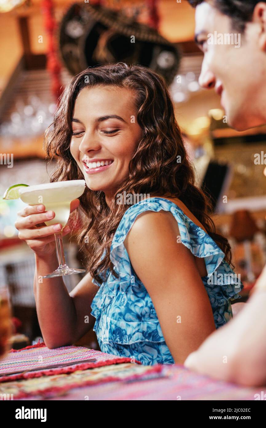 Couple drinking drinks in restaurant Stock Photo