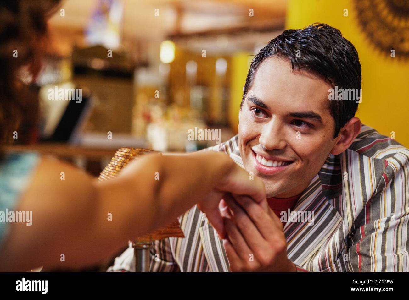 Man kissing woman's hand Stock Photo