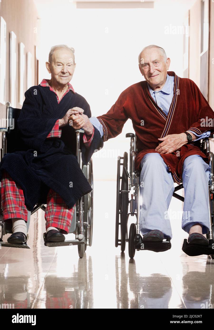 Two elderly men in wheelchairs hi-res stock photography and images - Alamy