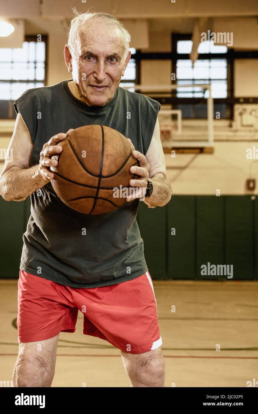 Elderly man playing basketball Stock Photo - Alamy