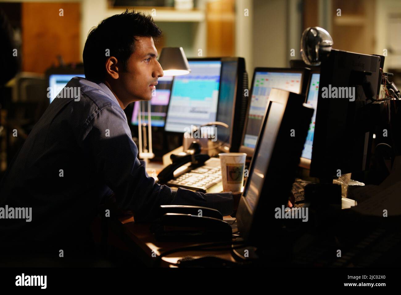Middle aged businessman working at his desk Stock Photo