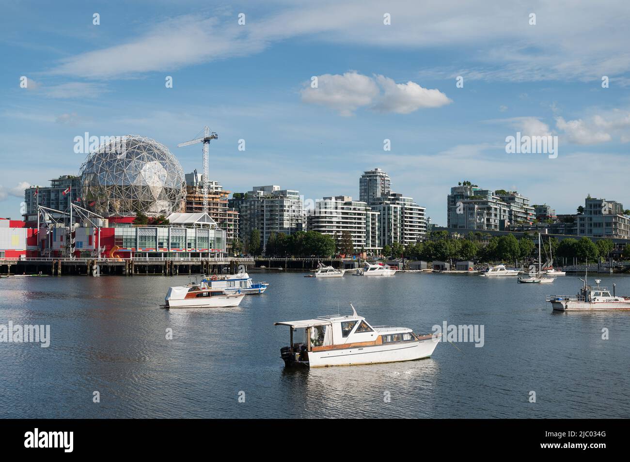 Live about yachts and boats moored in VancouverÕs False Creek in the Yaletown neighbourhood.  Vancouver BC, Canada. Stock Photo