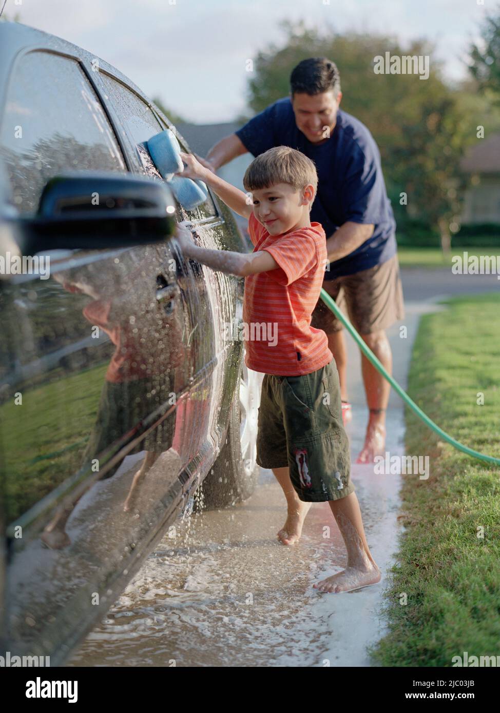 Father and son washing the car together Stock Photo - Alamy