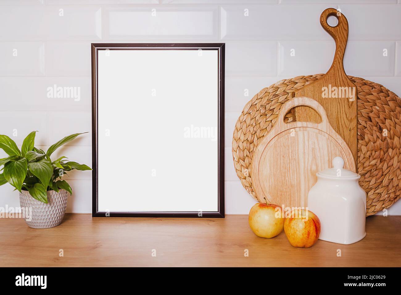 kitchen layout with black frame, apples, flowers, wooden boards, copy ...