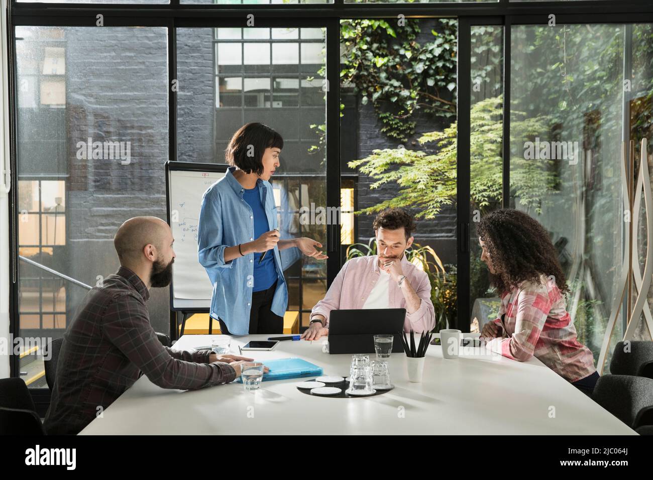 small meeting of colleges in conference room of co-working space Stock Photo