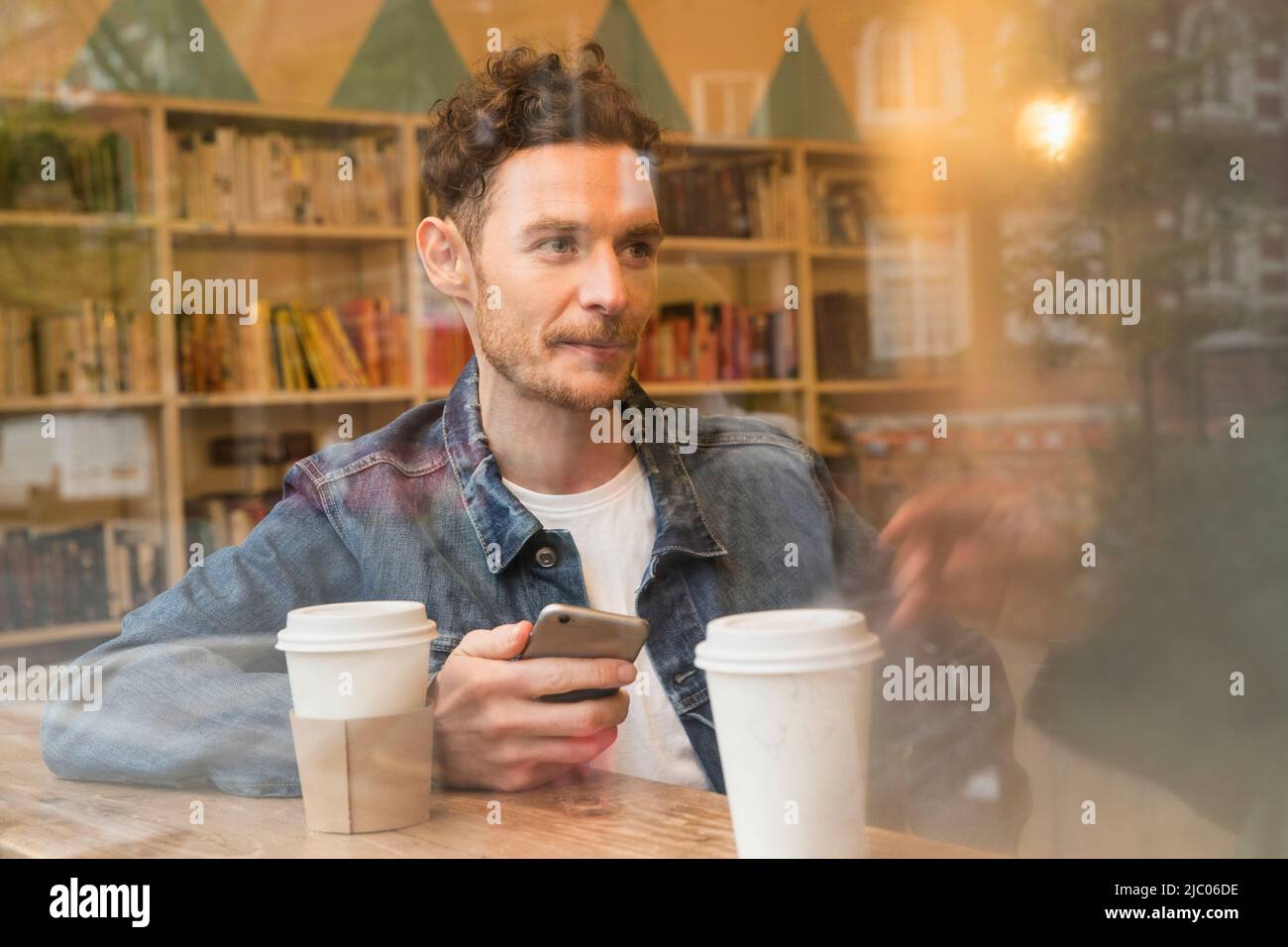 Mobile phone coffee shop uk hi-res stock photography and images - Alamy