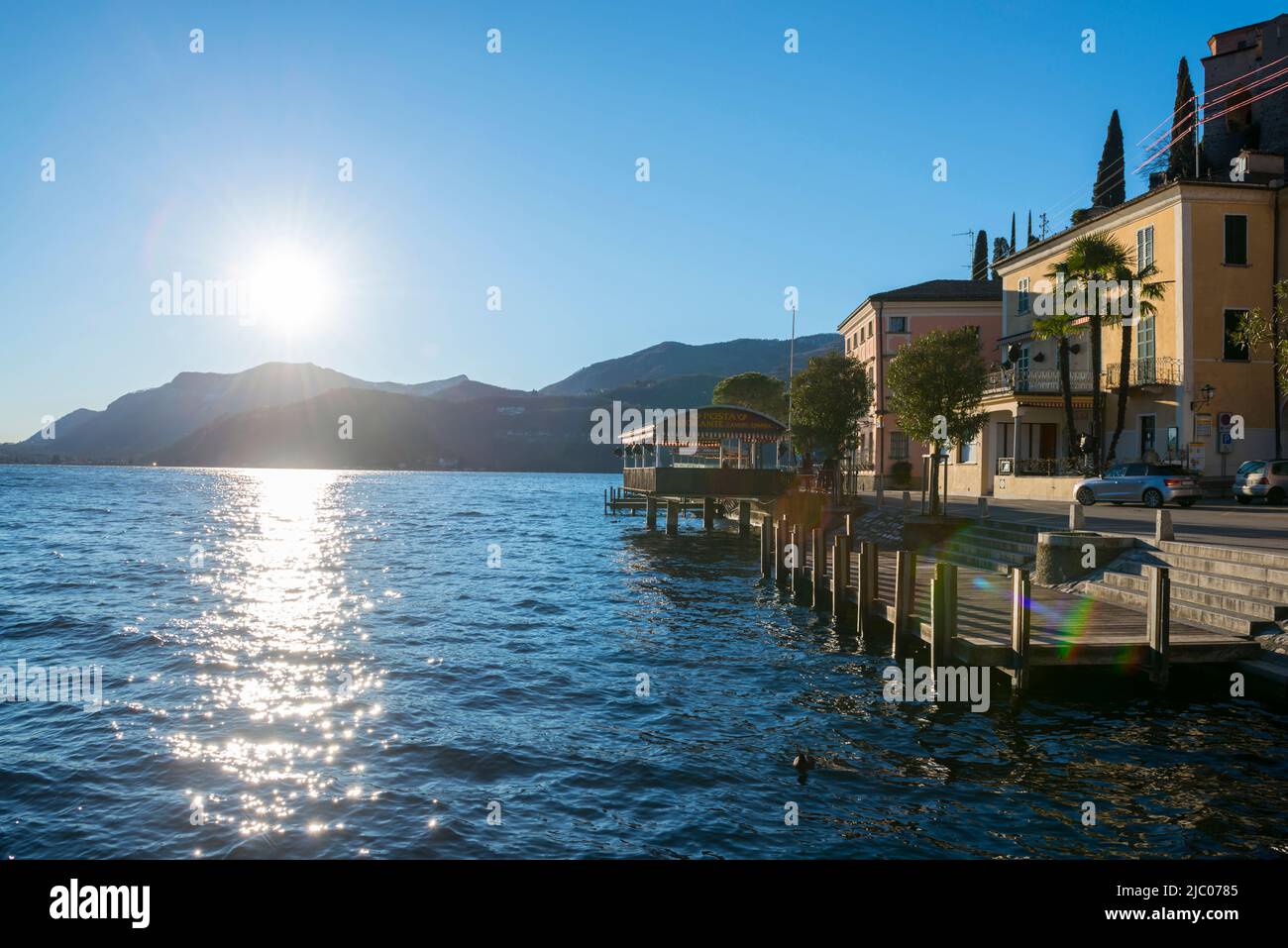 Village Morcote on Alpine Lake Lugano with Sunlight in Ticino, Switzerland. Stock Photo