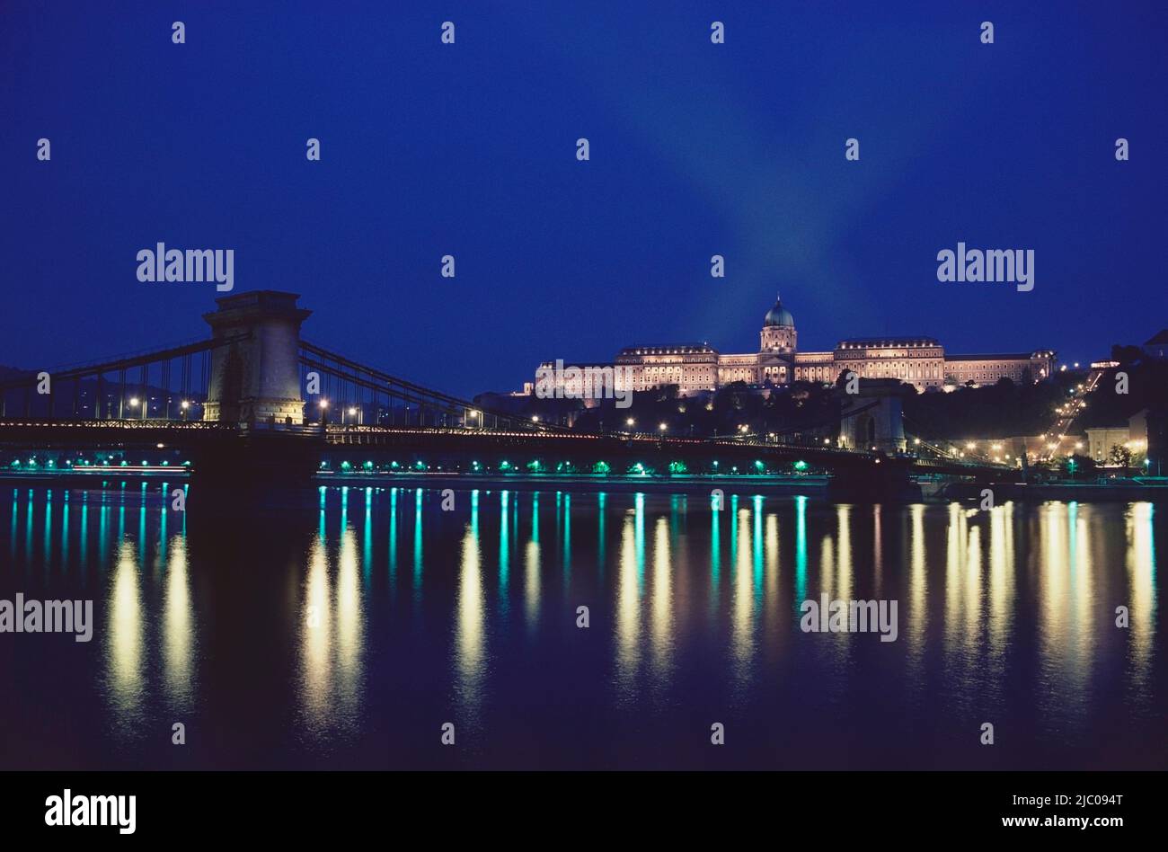 City lit up at night, Chain Bridge, Danube River, Royal Palace Of Buda, Budapest, Hungary Stock Photo