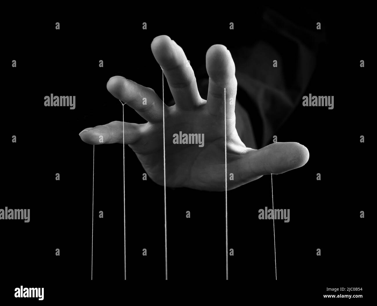 Man hand with strings on fingers. Manipulation, power concept. Male