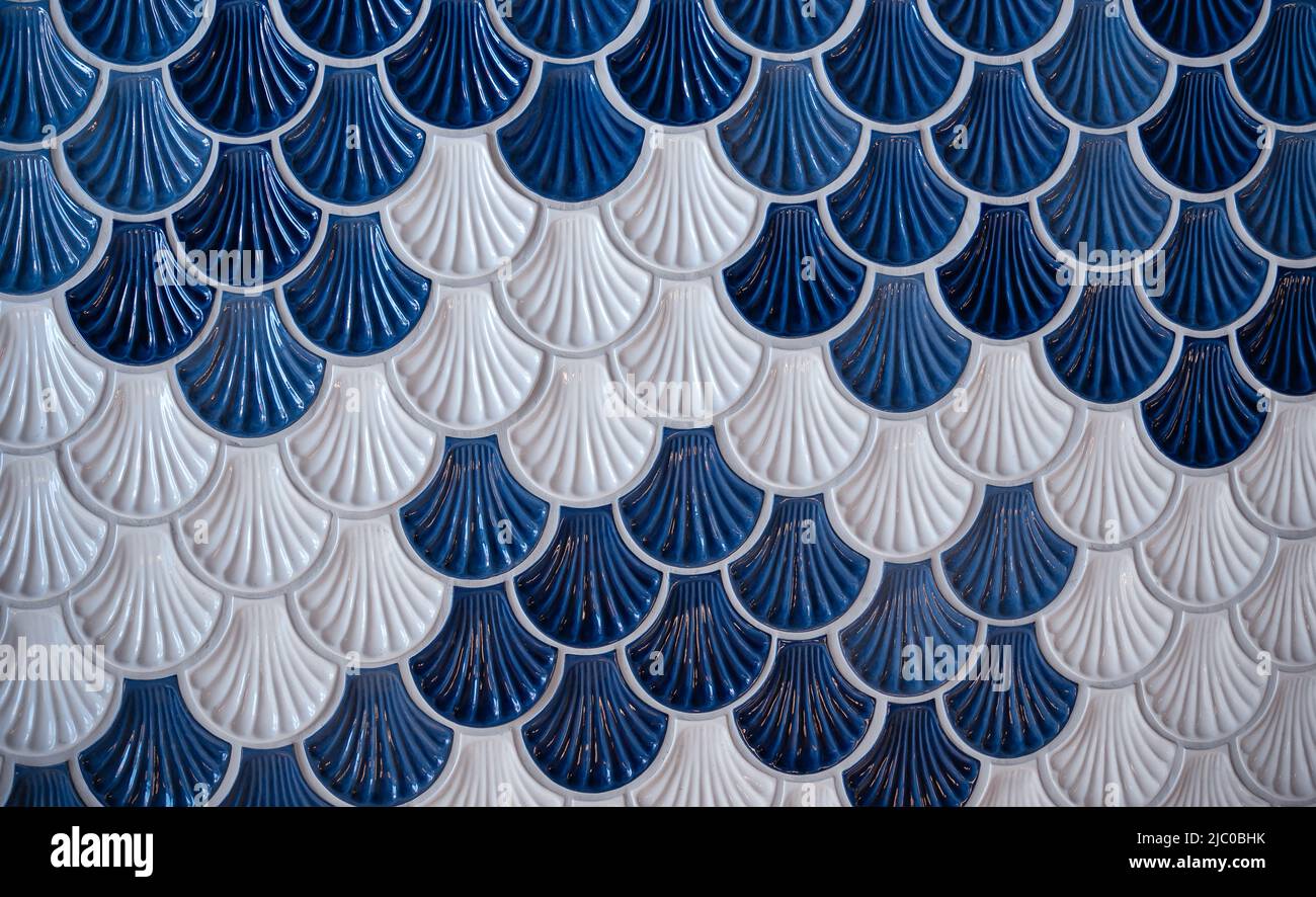 background of ceramic tiles in shell shape in blue and white Stock Photo