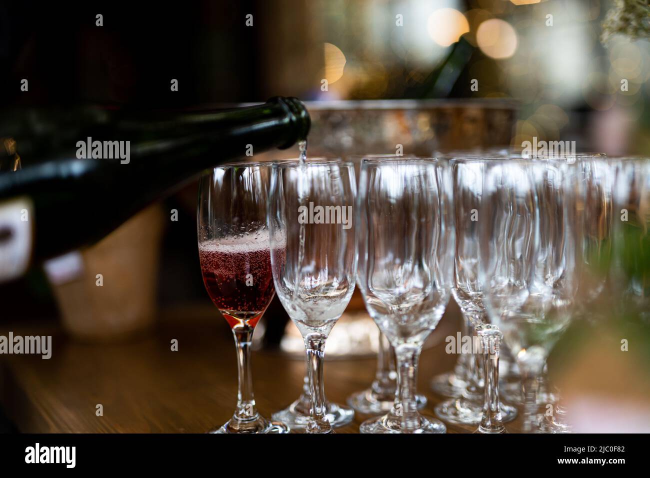 Luxury table settings for fine dining with and glassware, pouring wine