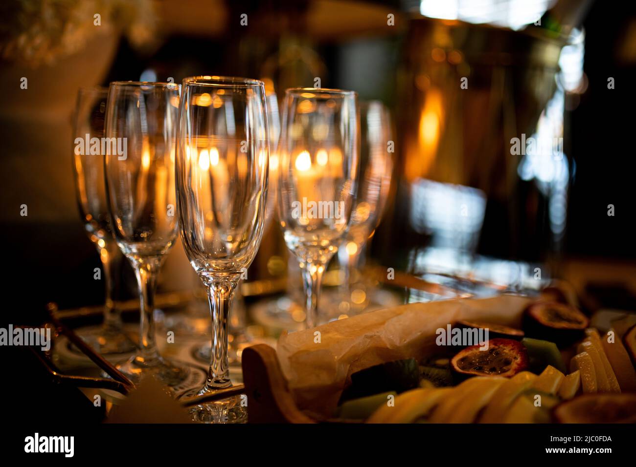 https://c8.alamy.com/comp/2JC0FDA/luxury-table-settings-for-fine-dining-with-and-glassware-pouring-wine-to-glass-beautiful-blurred-background-preparation-for-holiday-wedding-fancy-2JC0FDA.jpg