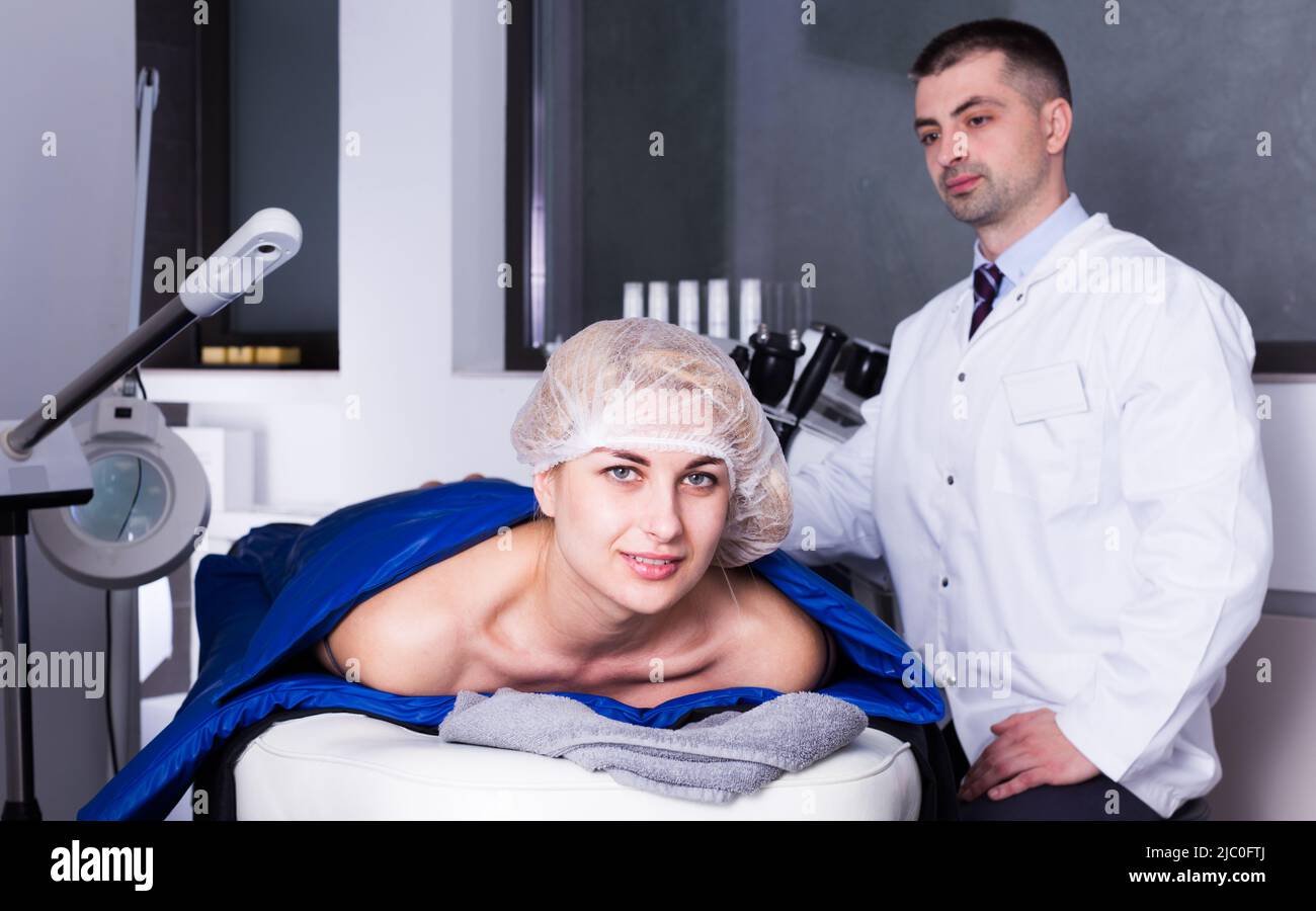 Woman getting cosmetological body procedure Stock Photo