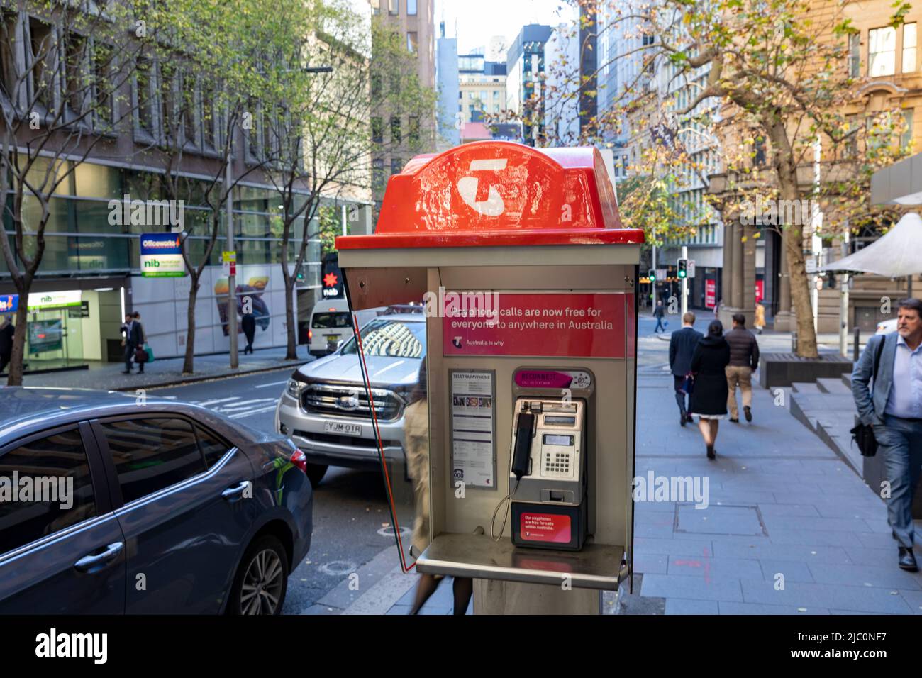Telstra payphone booth with telephone handset for making telephone calls, in Sydney city centre,NSW,Australia Stock Photo