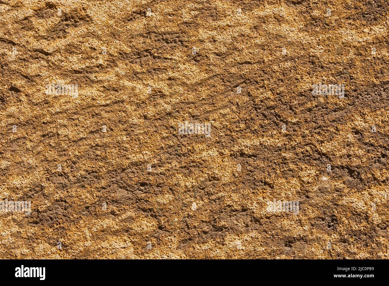Brownish stone with rough surface as background Stock Photo