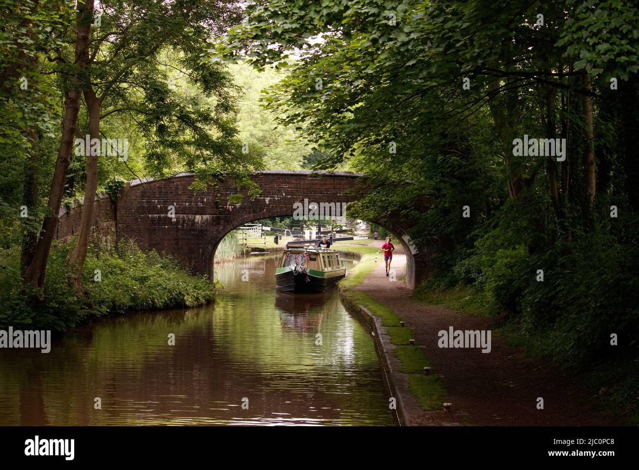 A canal boat pictured along the Coventry canal in Atherstone, North Warwickshire. Stock Photo