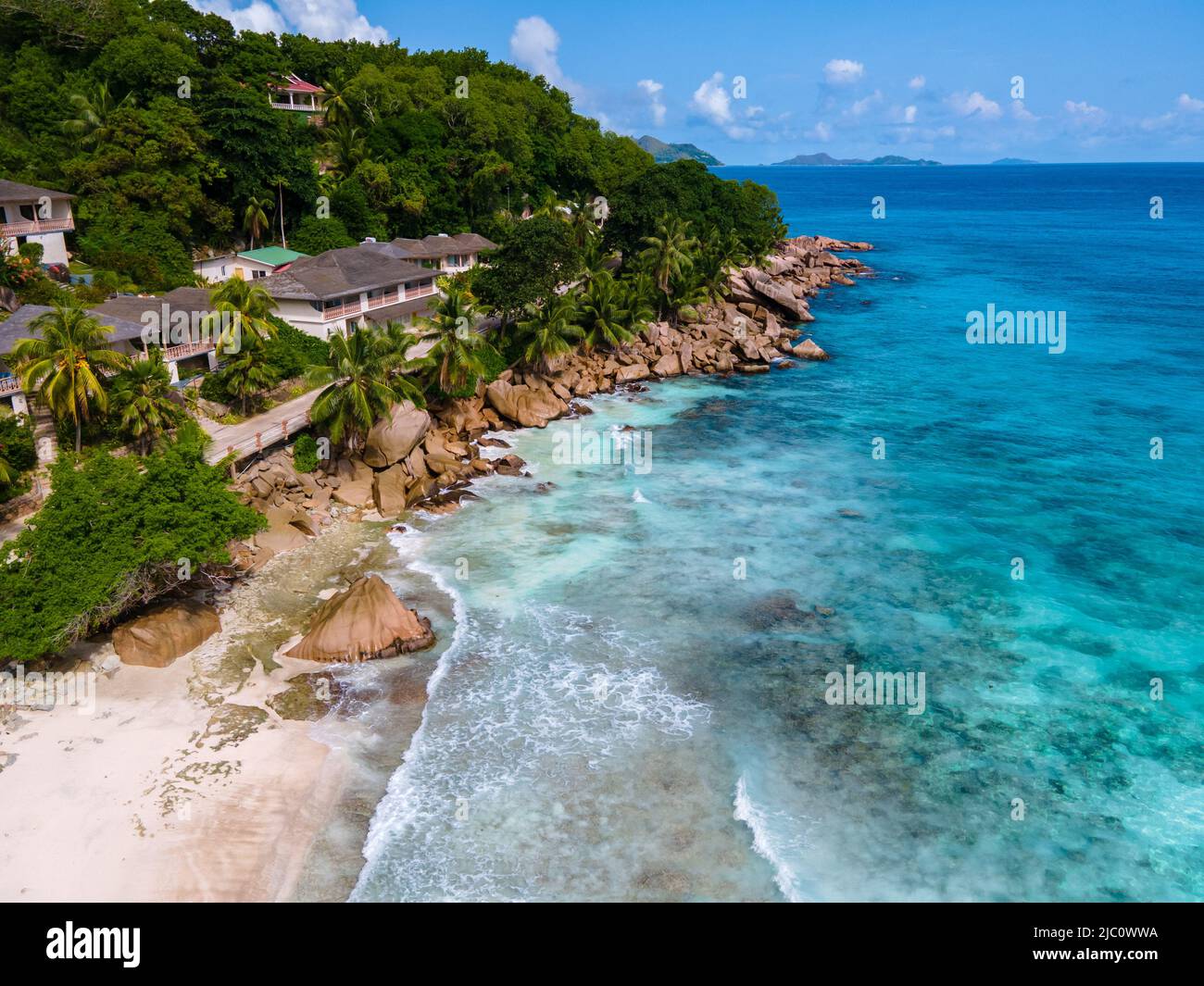 Anse Patates beach, La Digue Island, Seychelles, white beach with blue