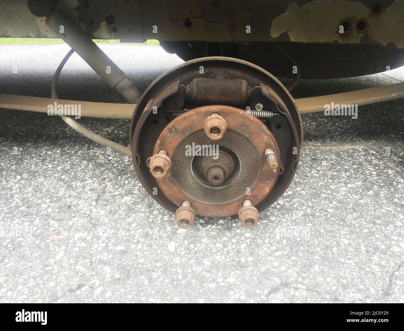 Illustrative photo, Ford Transit,rusty rear car wheel hub with drum