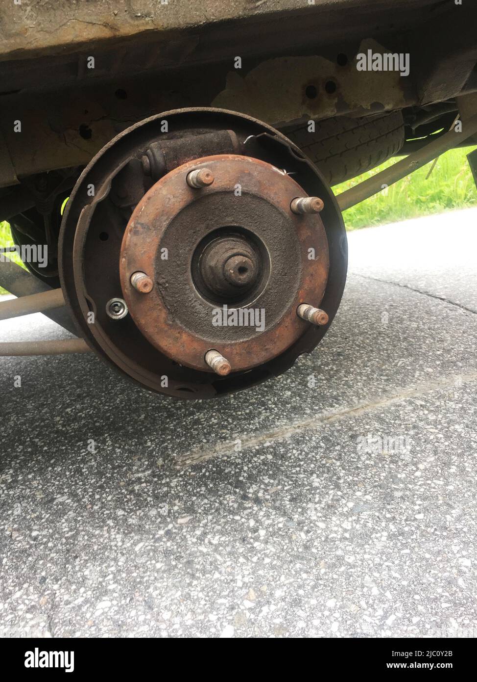 Illustrative photo, Ford Transit,rusty rear car wheel hub with drum