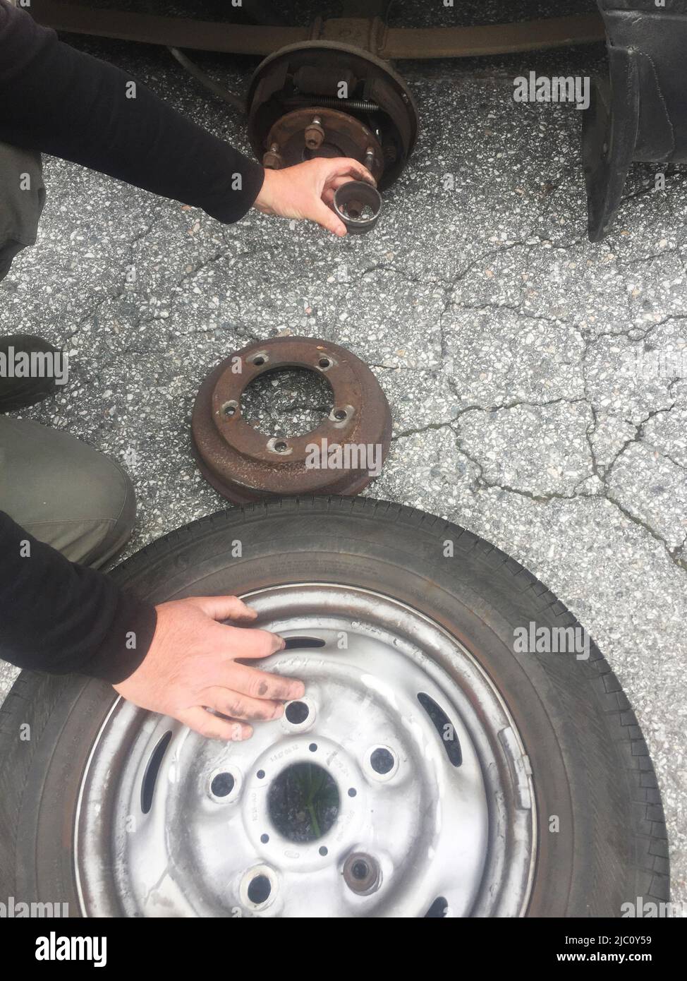 Illustrative photo, Ford Transit,rusty rear car wheel hub with drum