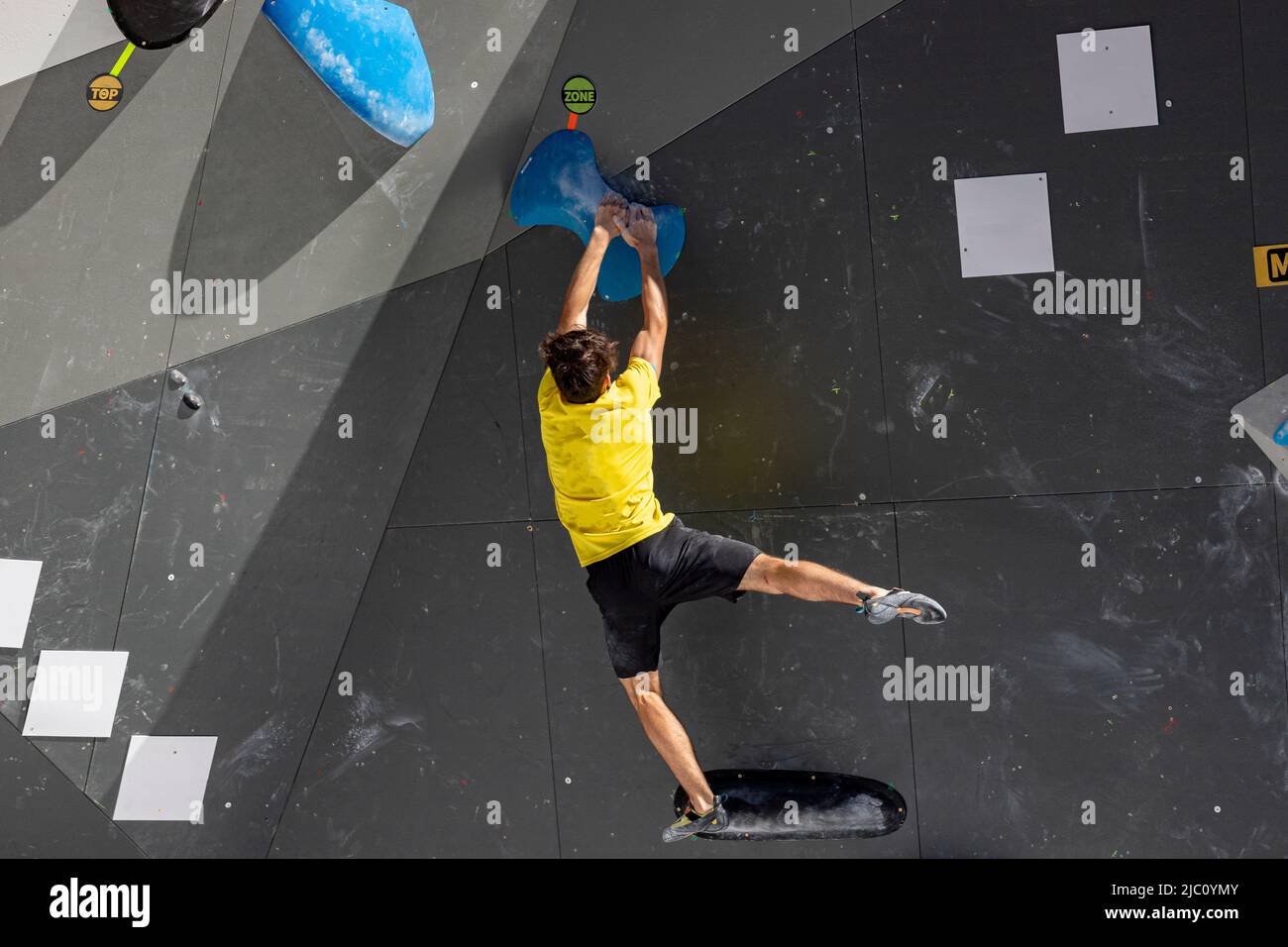 Climbing. Sport. Young person climbing in the Madrid Block Climbing